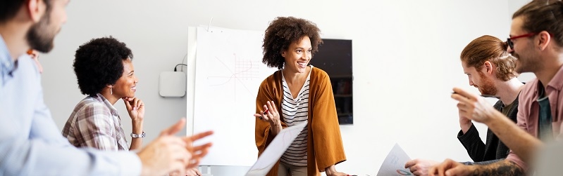 Woman presenting to a group of people